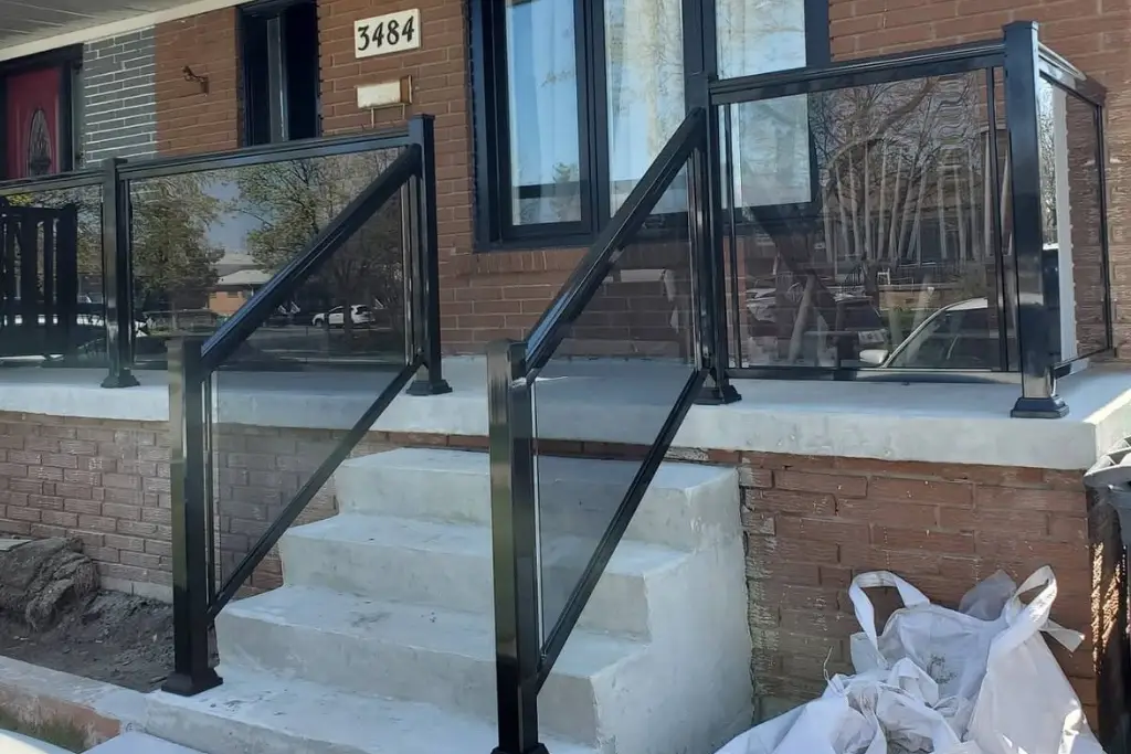 Black framed grey tinted glass porch railing in Cabbagetown, Toronto