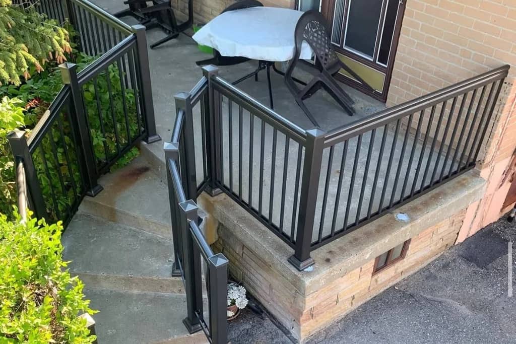 Black aluminum picket railing on a porch in Ajax