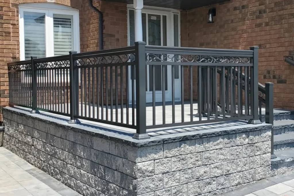 Black aluminum picket railing with decorative spindle design in Queen West, Toronto